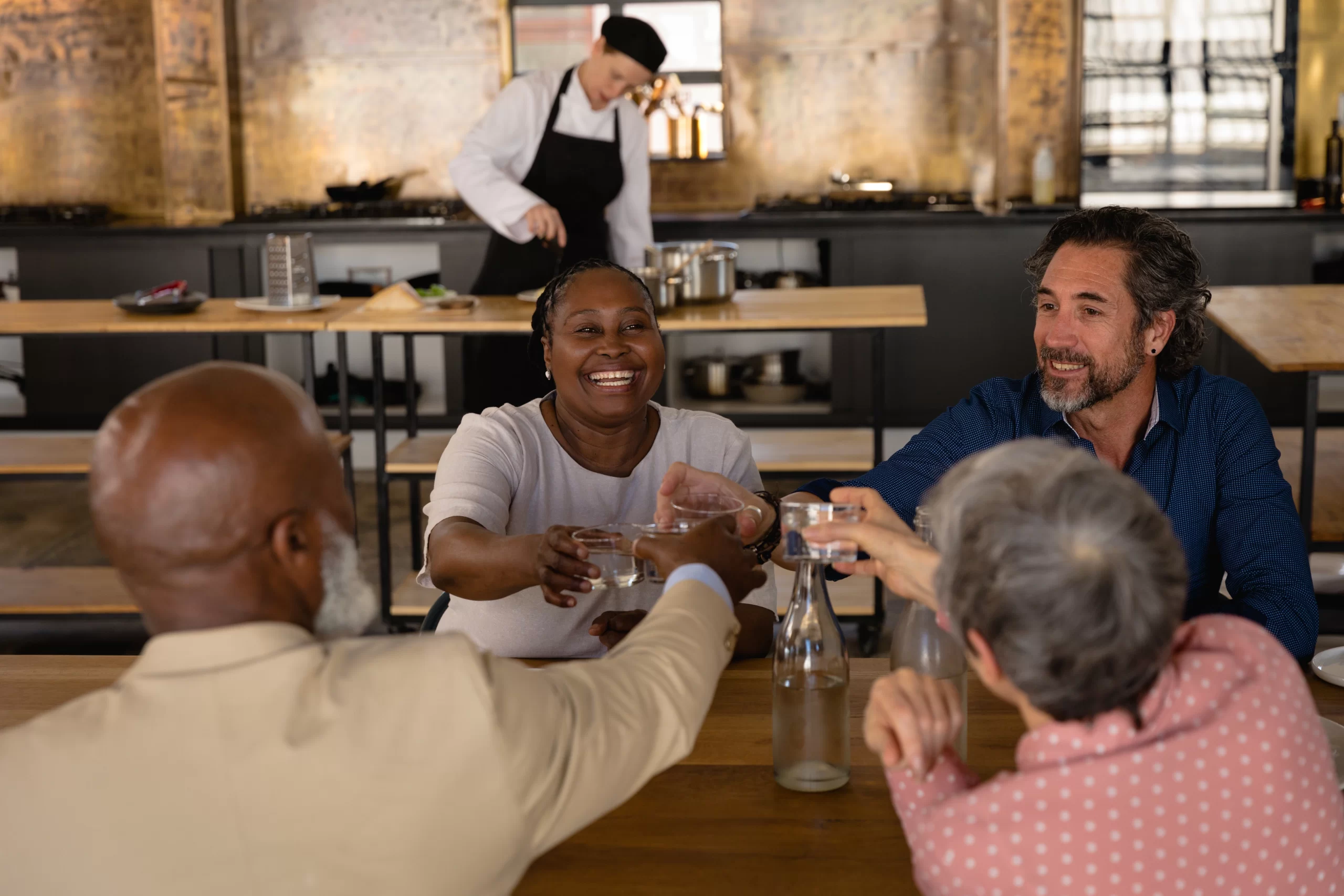 smiling friends toasting drinks at lunch in restau 2026 01 09 11 09 21 utc